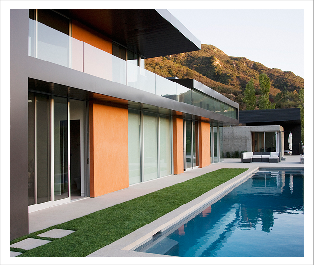 Modern home with pool and mountain backdrop