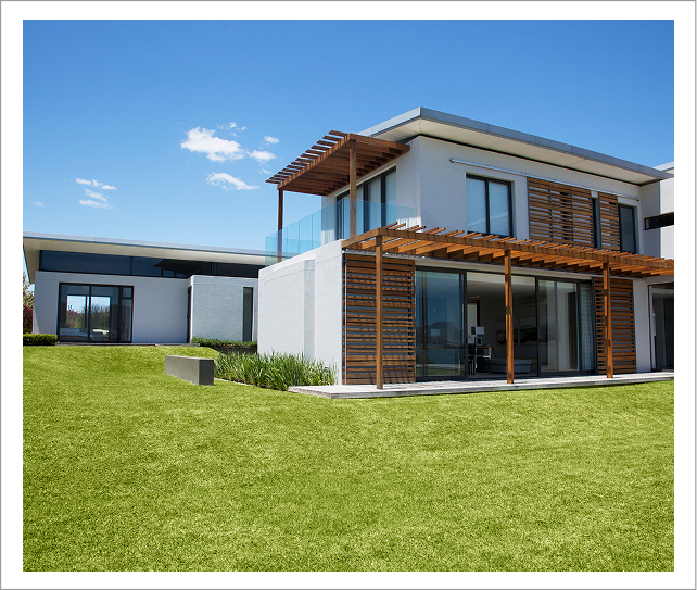Modern two-story house with wooden pergola