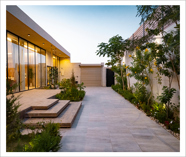 Modern home exterior with courtyard and landscaping