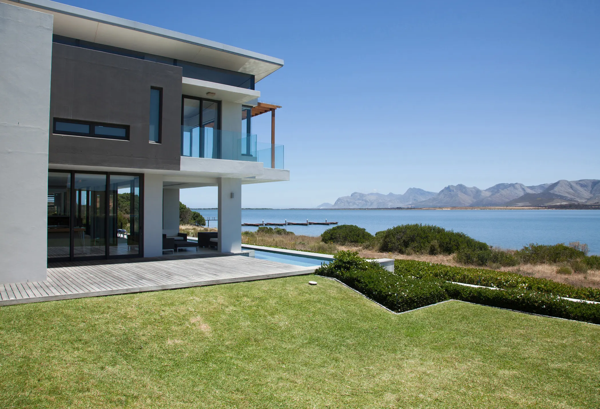 Modern beachfront house with ocean and mountains