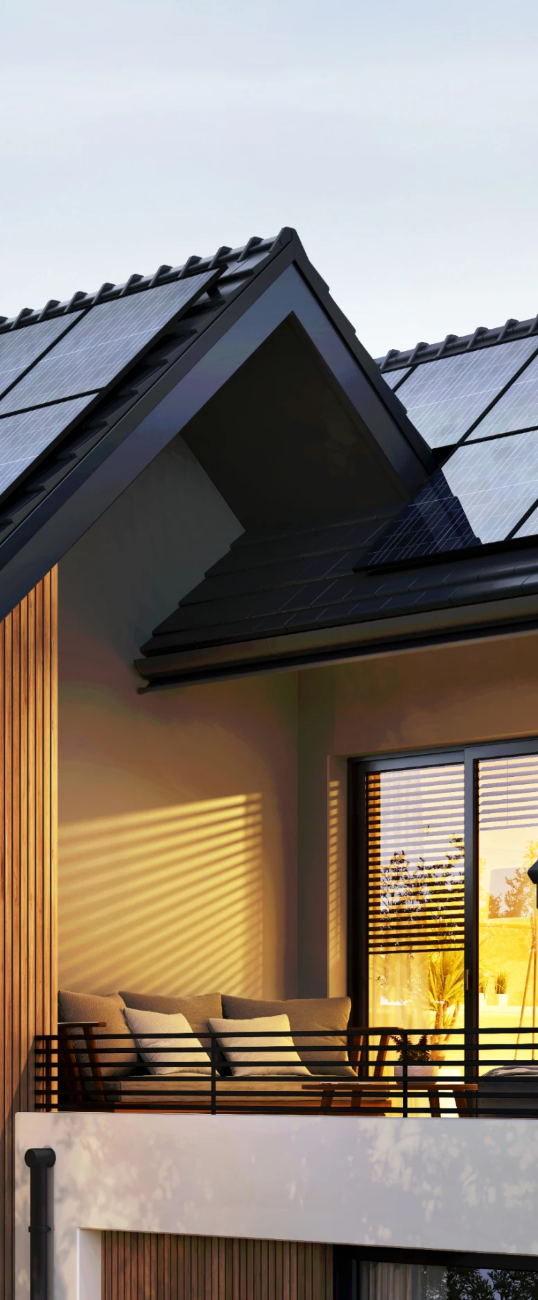 Modern house with solar panels at sunset.